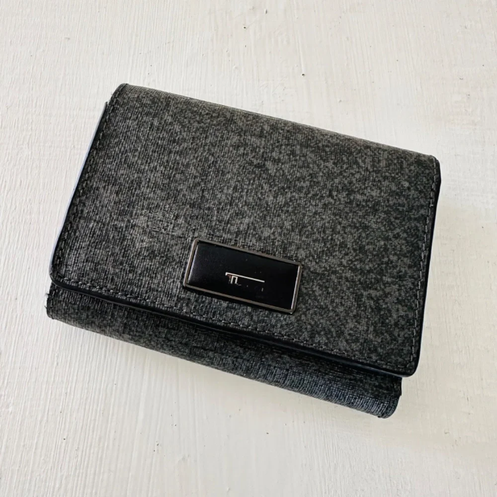 Tumi Crafted from leather, this refined and durable tri-fold wallet offers super